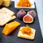 Cheese platter with crackers and carrot chutney