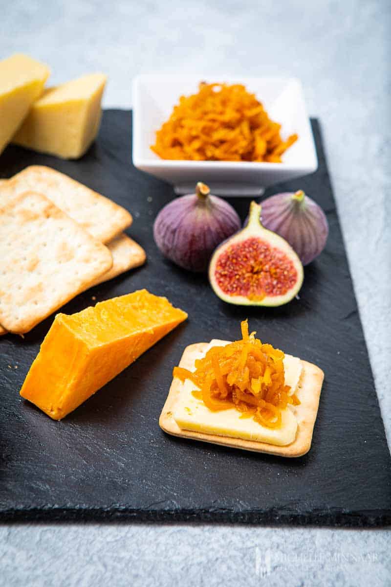 Cheese platter with crackers and carrot chutney