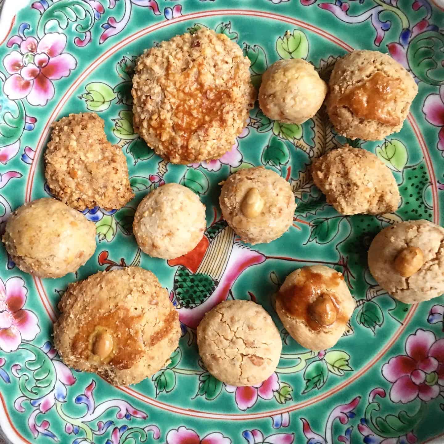 12 types of Chinese peanut cookies made from 12 different recipes on a plate