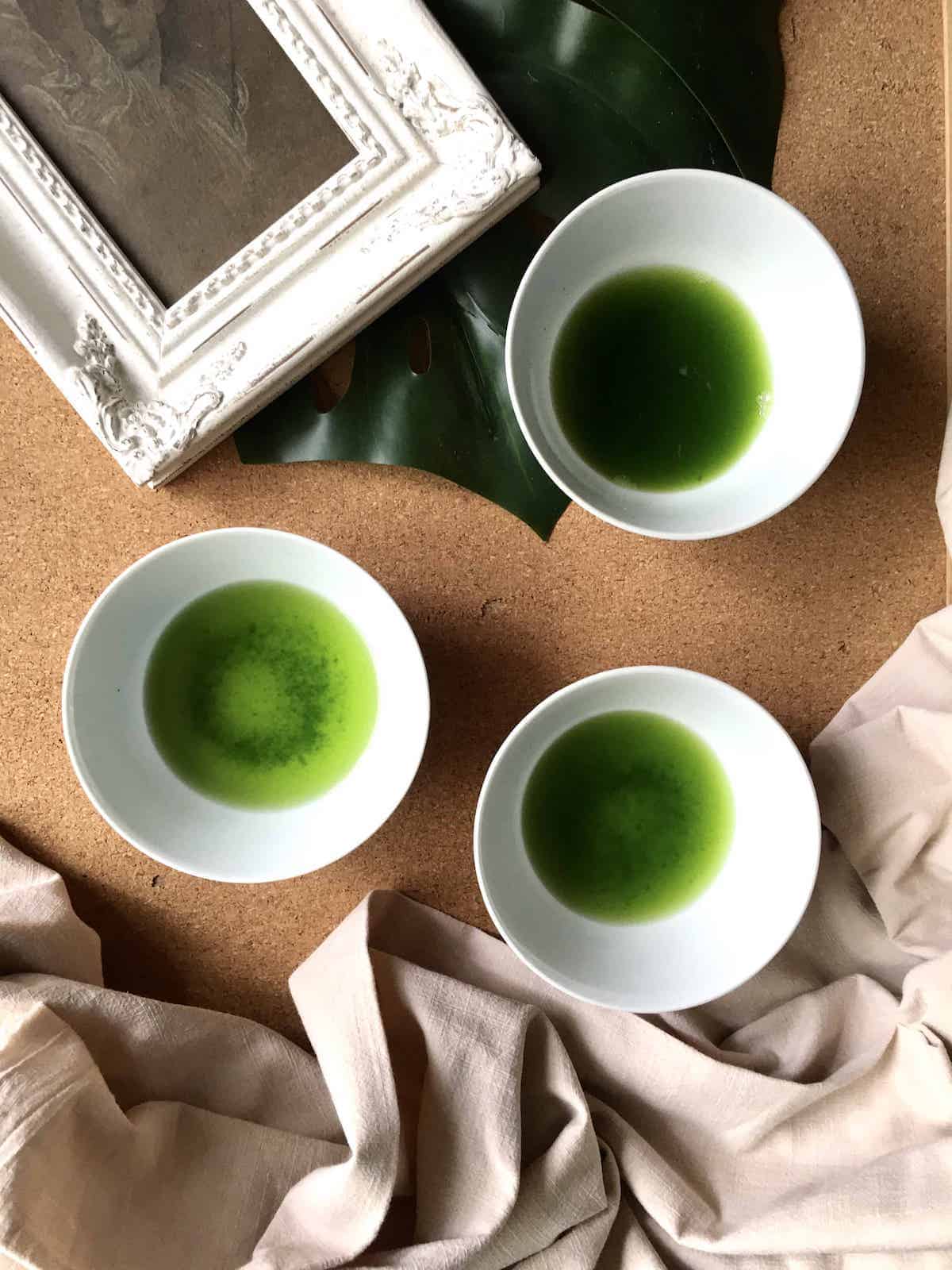 3 bowls of green homemade pandan juice.