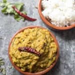 A bowl of curry leaf tomato chutney and rice