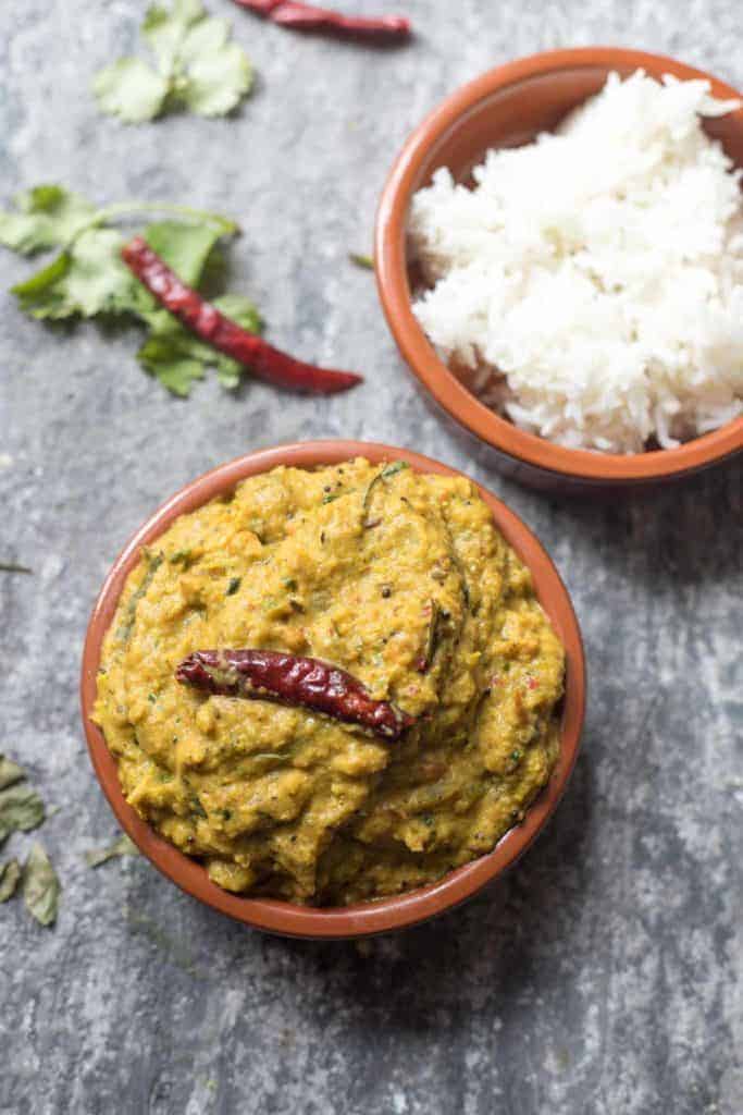 A bowl of curry leaf tomato chutney and rice