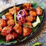 A platter of chicken baked with curry leaves