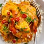 A plate of rice and shrimp curry.