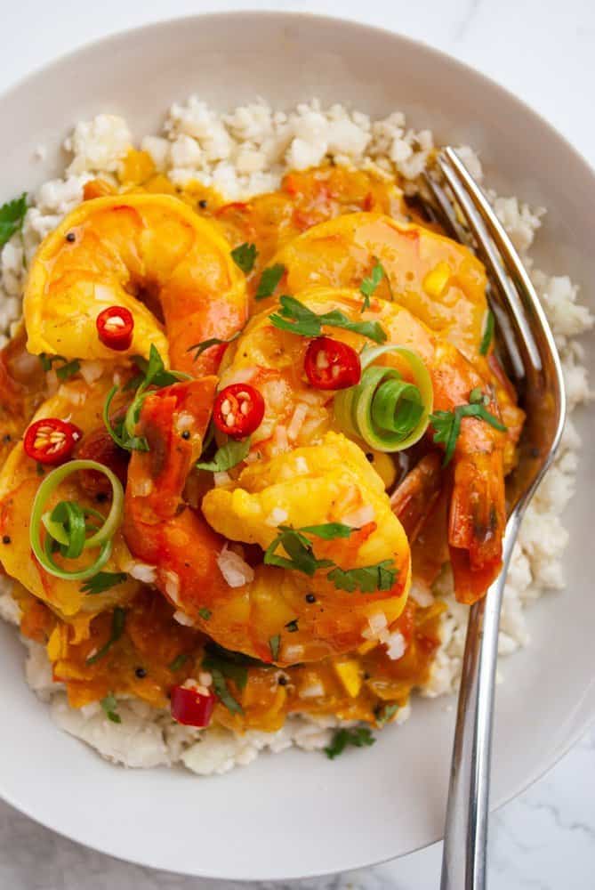 A plate of rice and shrimp curry.