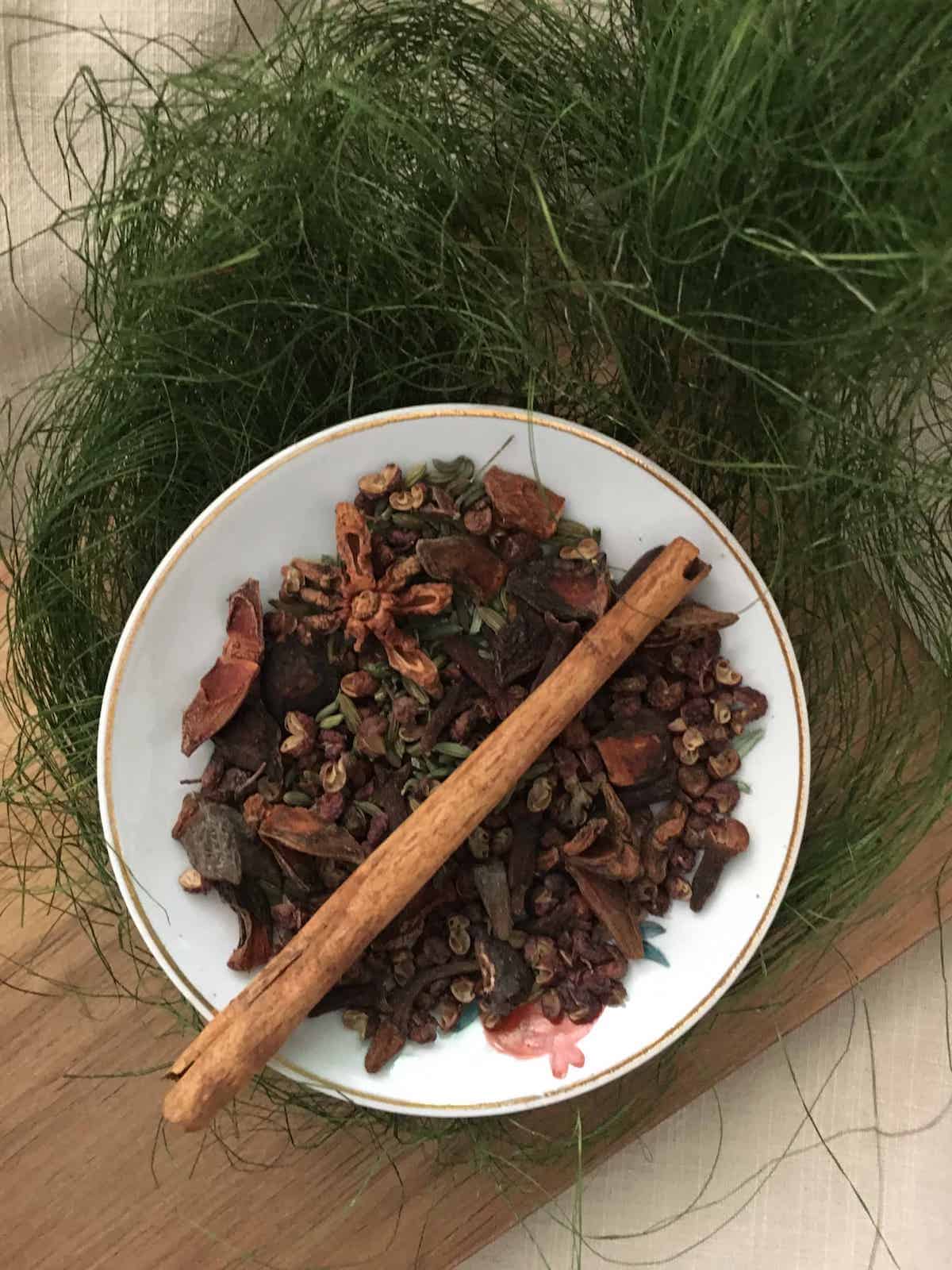 A plate of spices to grind into Chinese 5-spice powder.