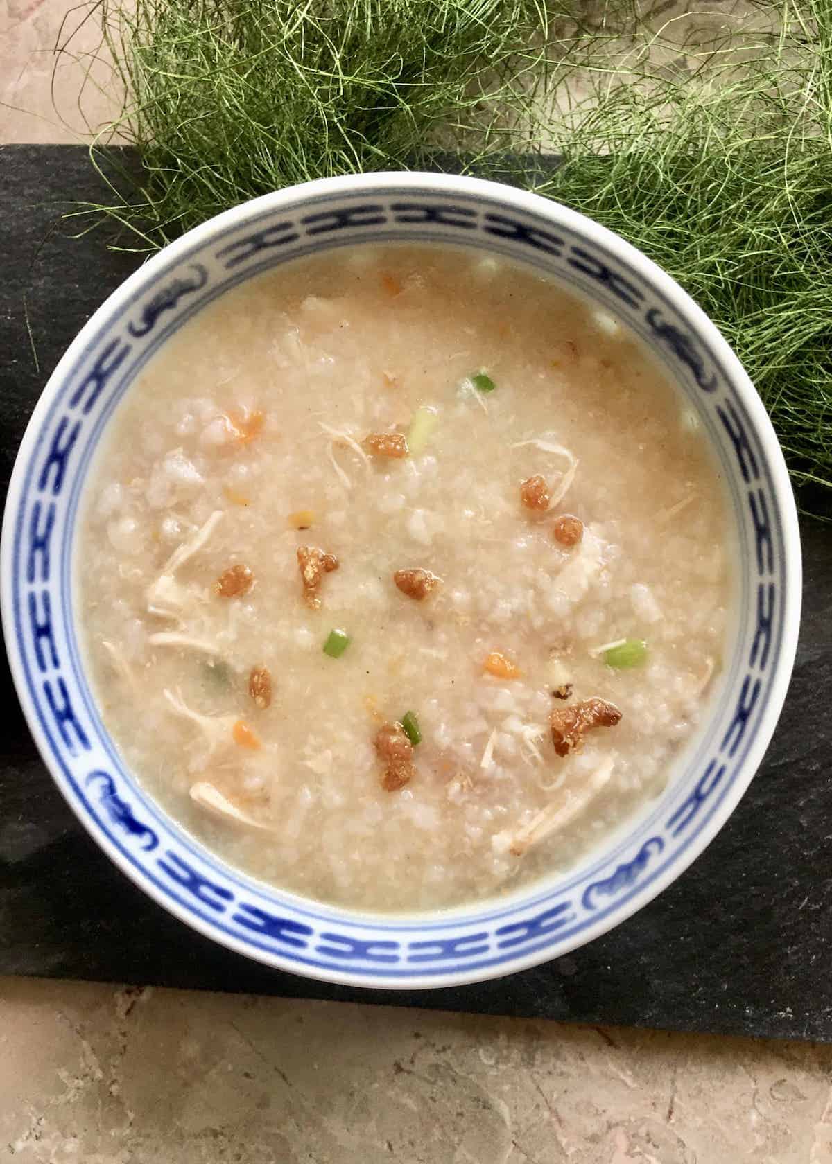 A close-up of a bowl of chicken congee