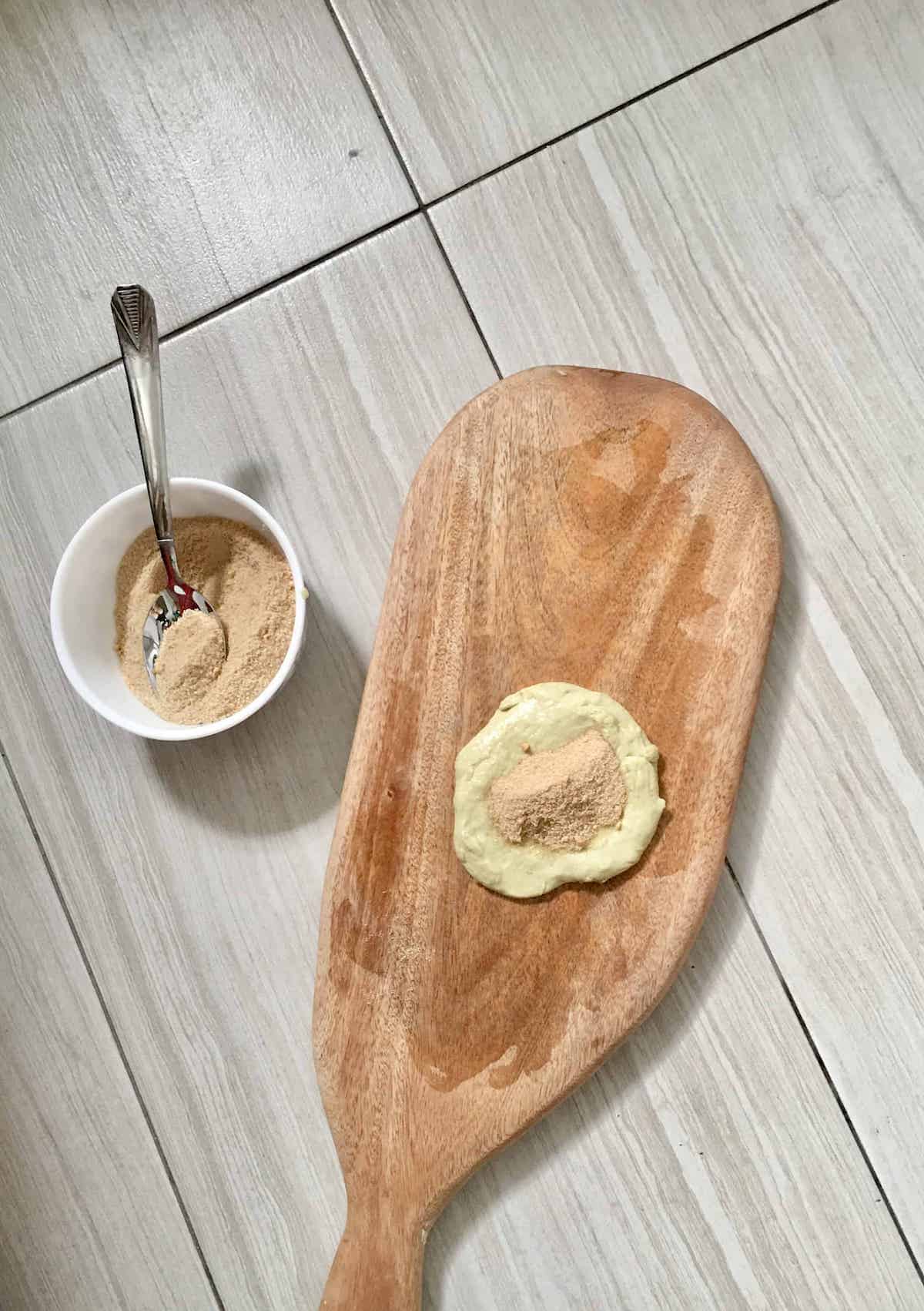 Flattening the dough to make hotteok