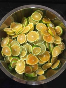 A bowl of sliced Korean green tangerines used to make cheong