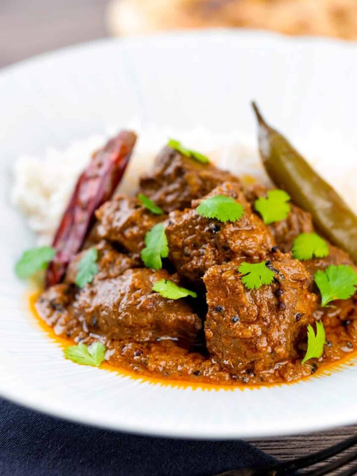 Close-up of achar gosht lamb curry.