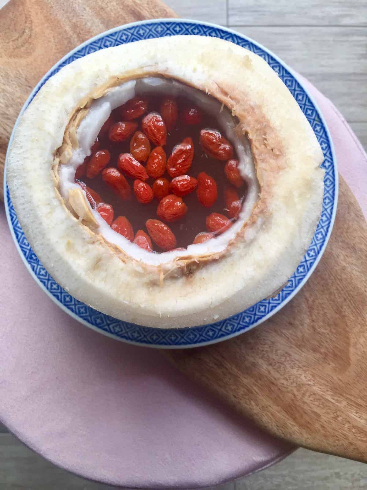 Bird's nest and wolfberries Chinese dessert served in a coconut bowl