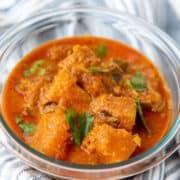 A bowl of orange Sri Lankan pumpkin curry with coriander.