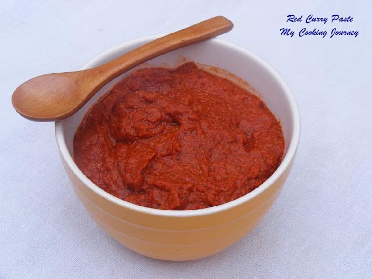 A well-blended red curry paste in a bowl, with no visible pieces of herbs and spices.