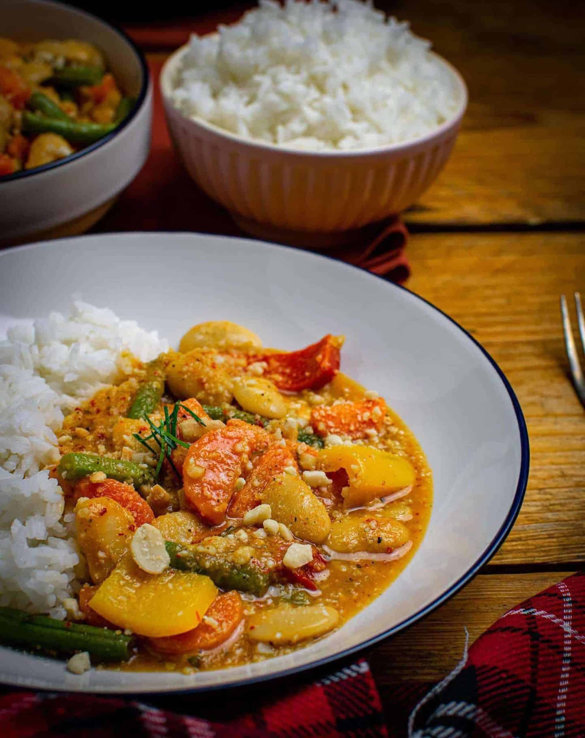 Thai panang curry with rice on a plate.