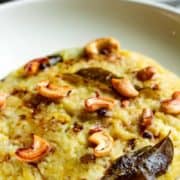 Close-up of Ven Pongal on a white plate.