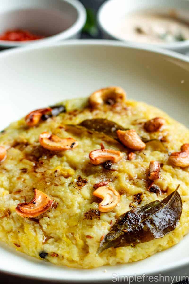 Close-up of Ven Pongal on a white plate.