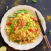 A colourful plate of curry fried rice.