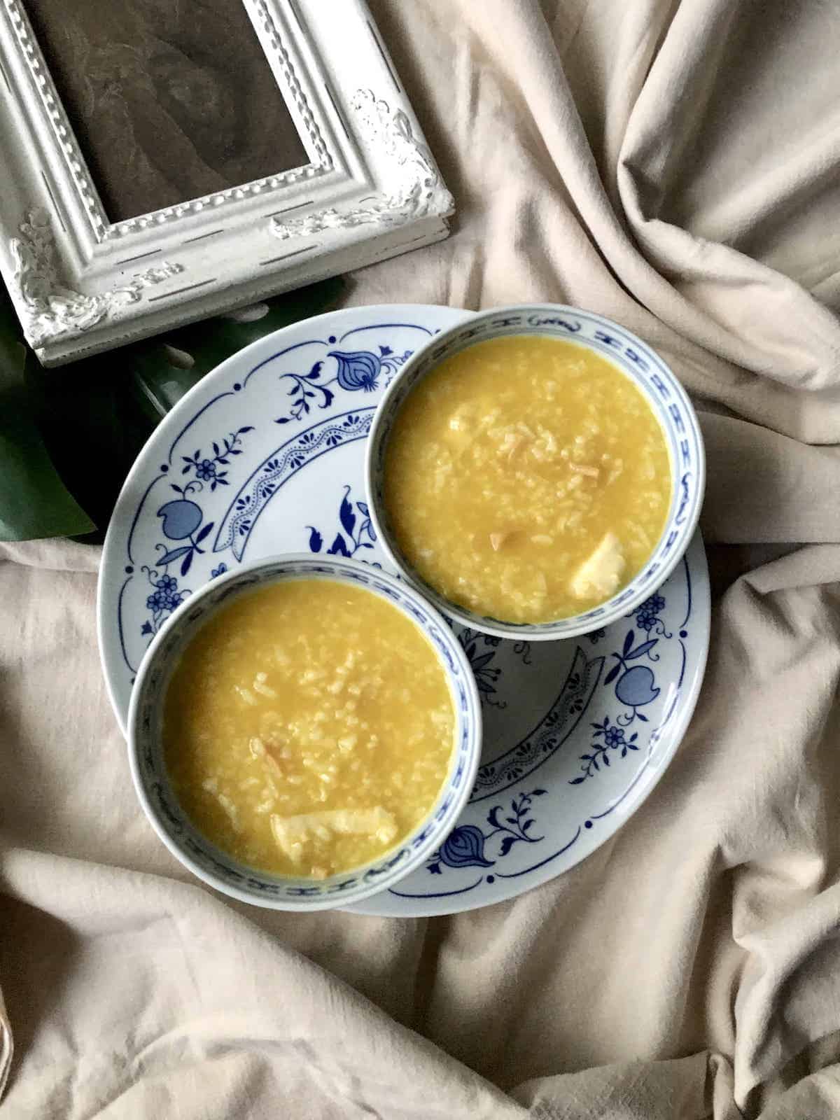 2 bowls of golden pumpkin fish porridge