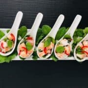 Lemongrass & prawn salad presented on Chinese spoons.