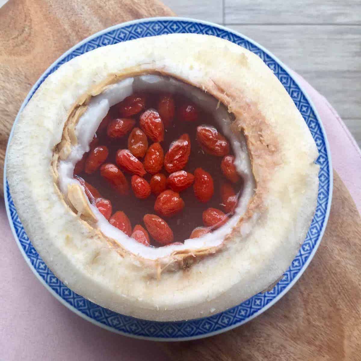 Close up of red goji berries and birds nest steamed in a coconut