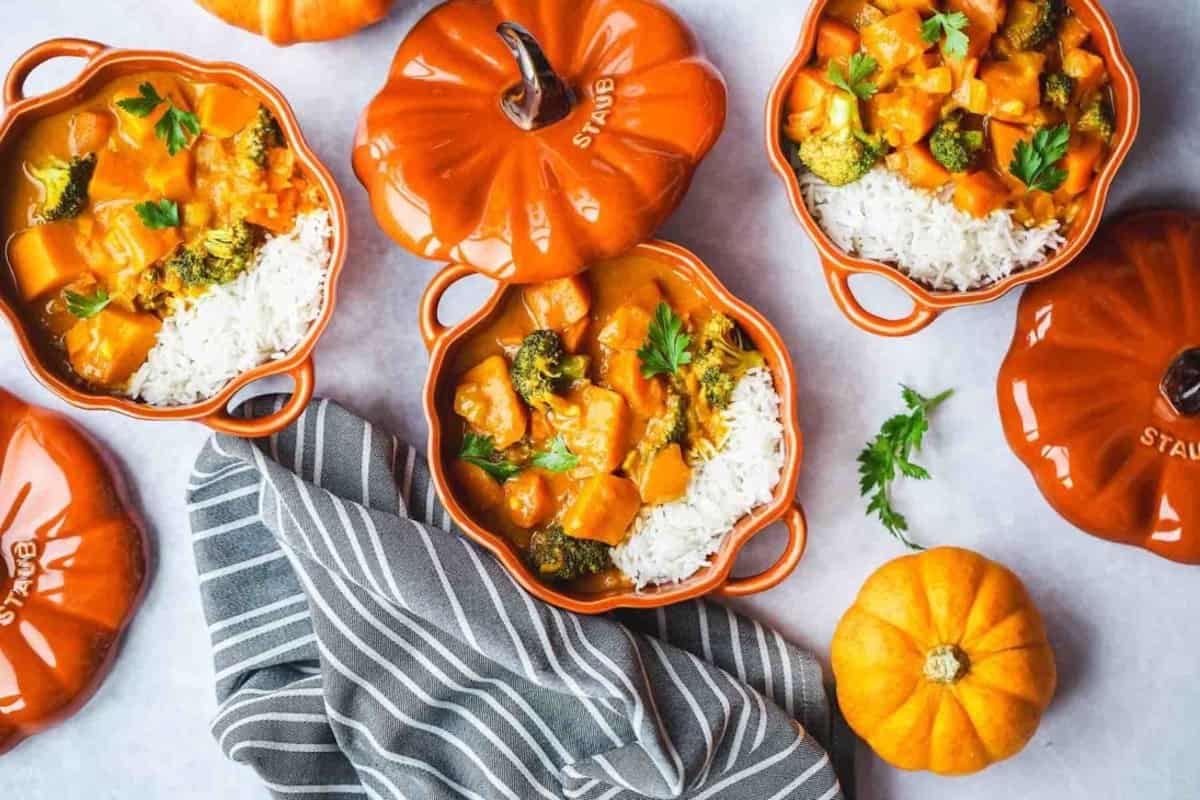 3 bowls of vegan pumpkin curry and white rice.