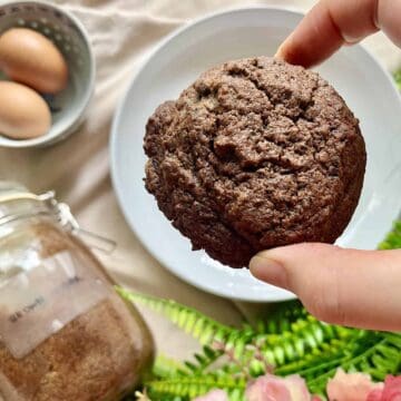 Close-up of a large, thick chocolate black sesame cookie.