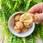 Close-up of a half-bitten mochi cheese bread ball.