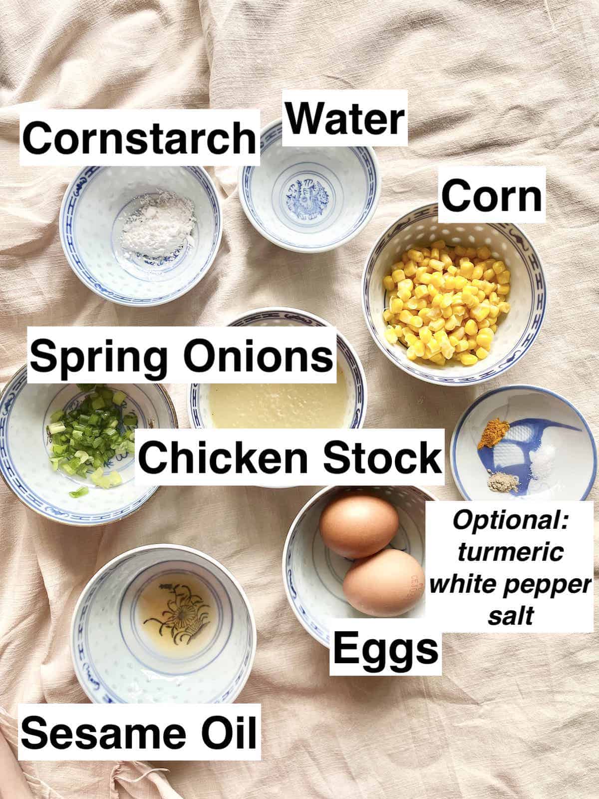 The ingredients for corn egg drop soup on a cloth.