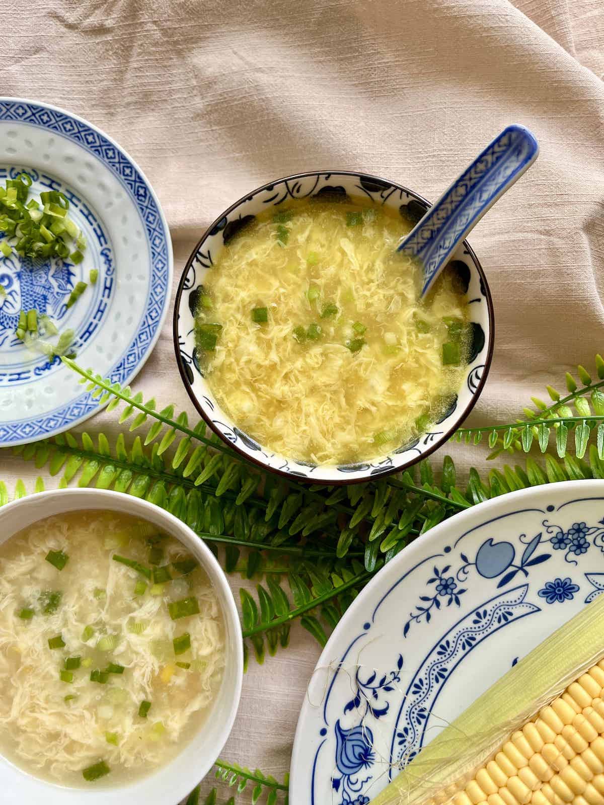 2 bowls of Chinese egg soup with corn.