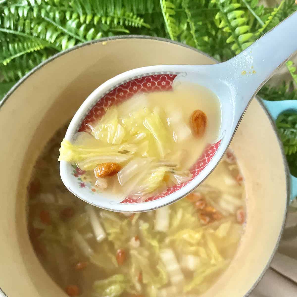Scooping up some homemade Chinese Cabbage Soup with wolfberries.