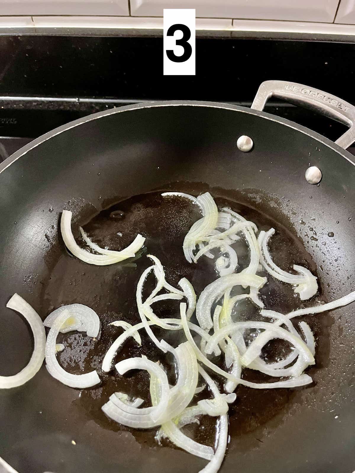 Sauteing onions in a non-stick pan.