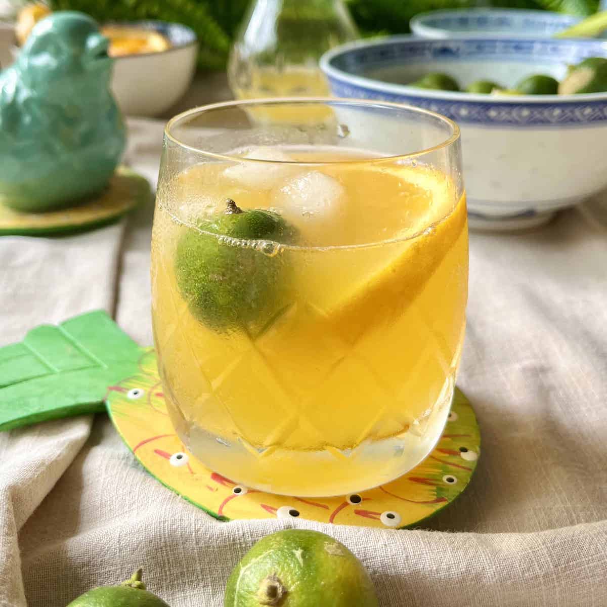 A glass of homemade Calamansi Juice with ice.