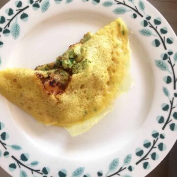 A golden Vietnamese crepe on a plate.