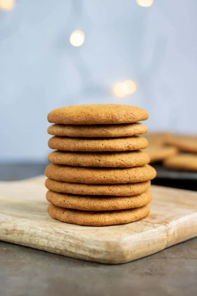 A pile of Icelandic pepper cookies or piparkoku on a tile against a blue background that looks like the skyr