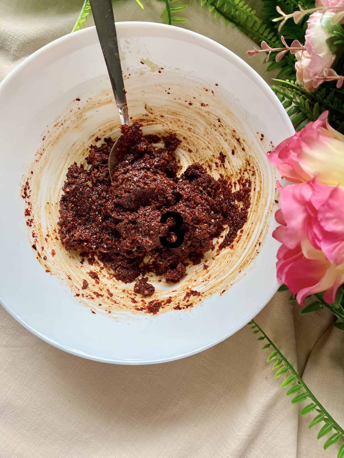 Homemade gochujang paste in a white bowl.