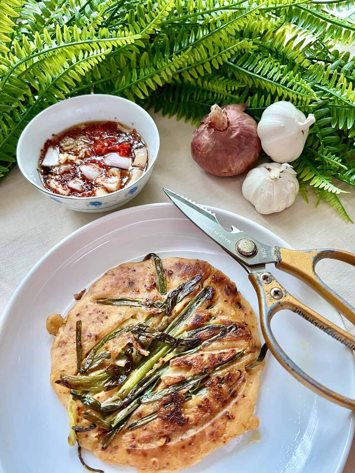 Crispy Korean green onions pancake and dipping sauce.