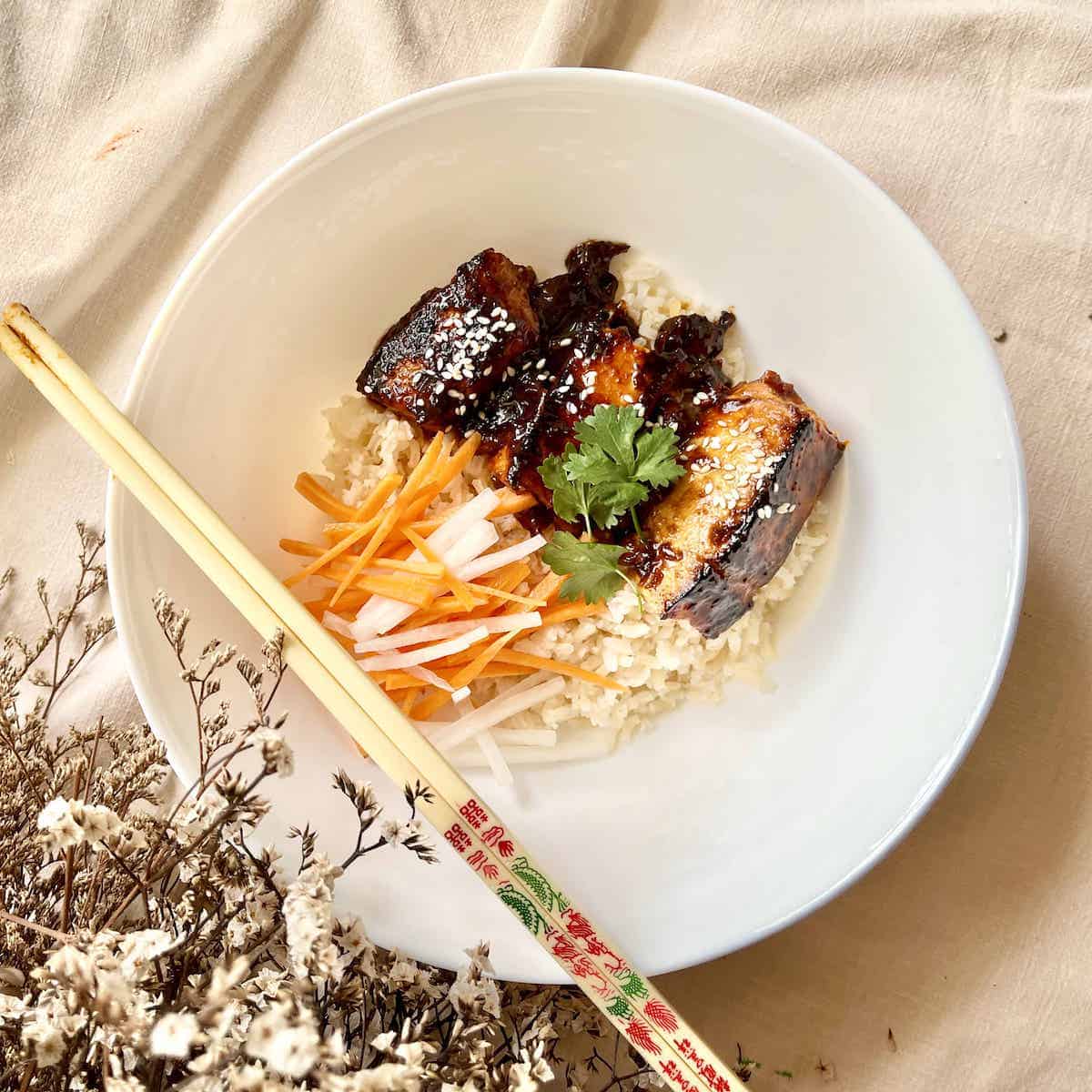 Miso Butter Salmon Rice bowl with pickled daikon and carrots.