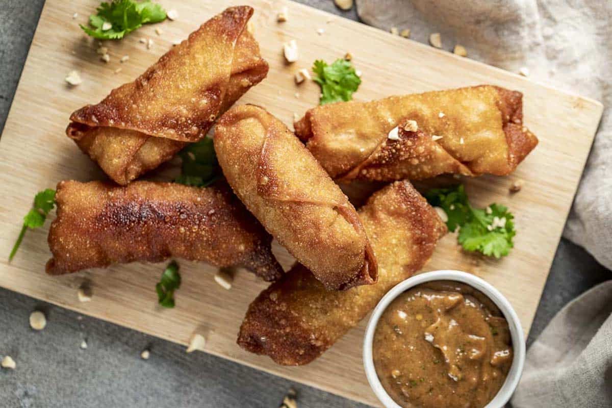 Golden egg rolls on a platter.