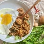 A plate of Spicy Thai Basil Fried Rice with Shrimp and Egg.