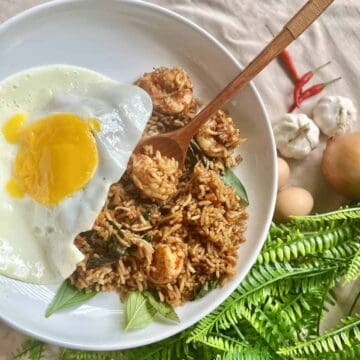 A plate of Spicy Thai Basil Fried Rice with Shrimp and Egg.