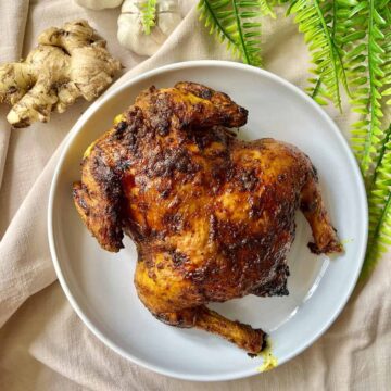 Roasted whole chicken with a turmeric black pepper rub.