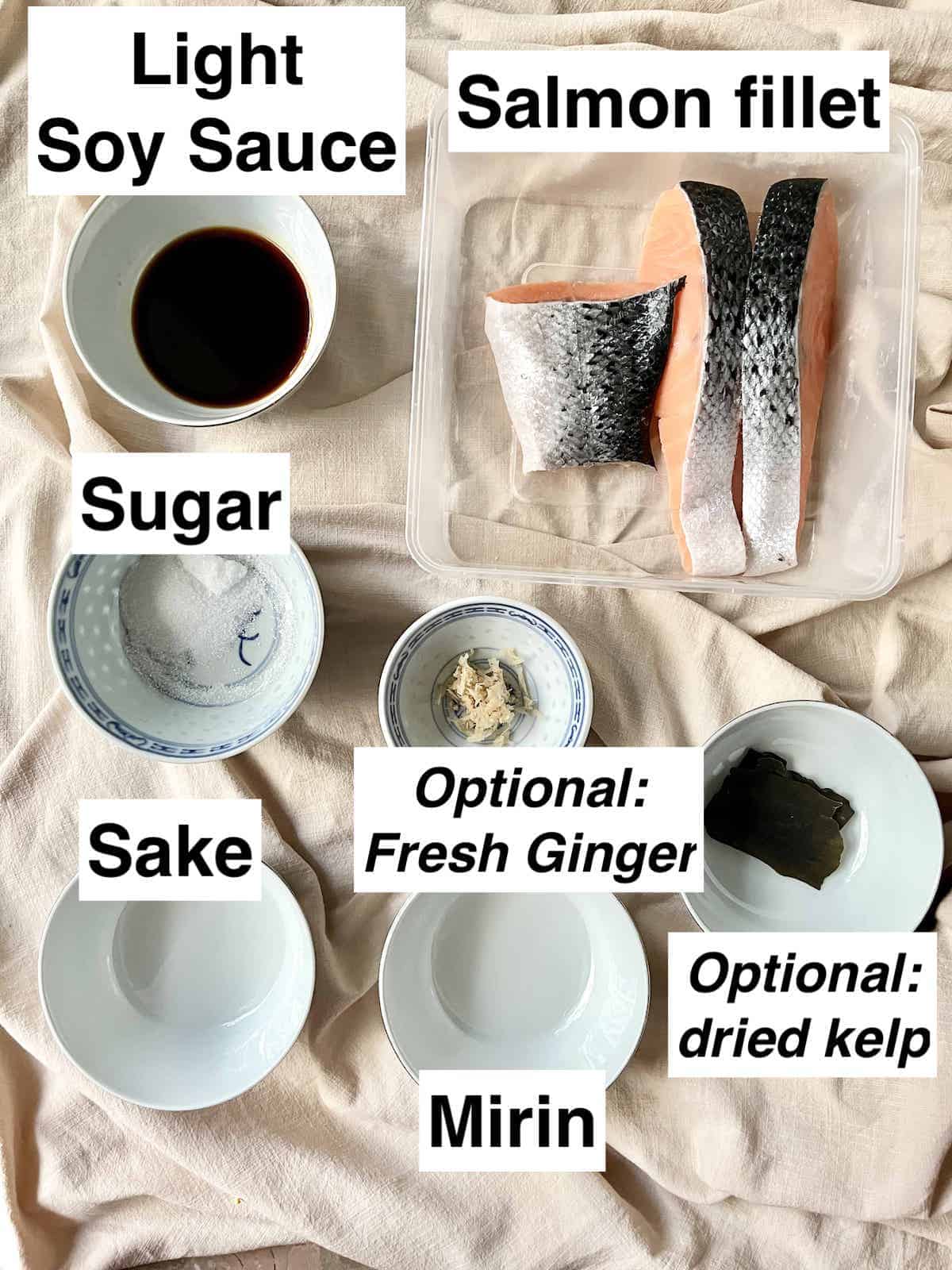 The ingredients needed to make Japanese salmon teriyaki on a linen cloth.