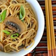 Close-up of sesame noodles in a bowl.