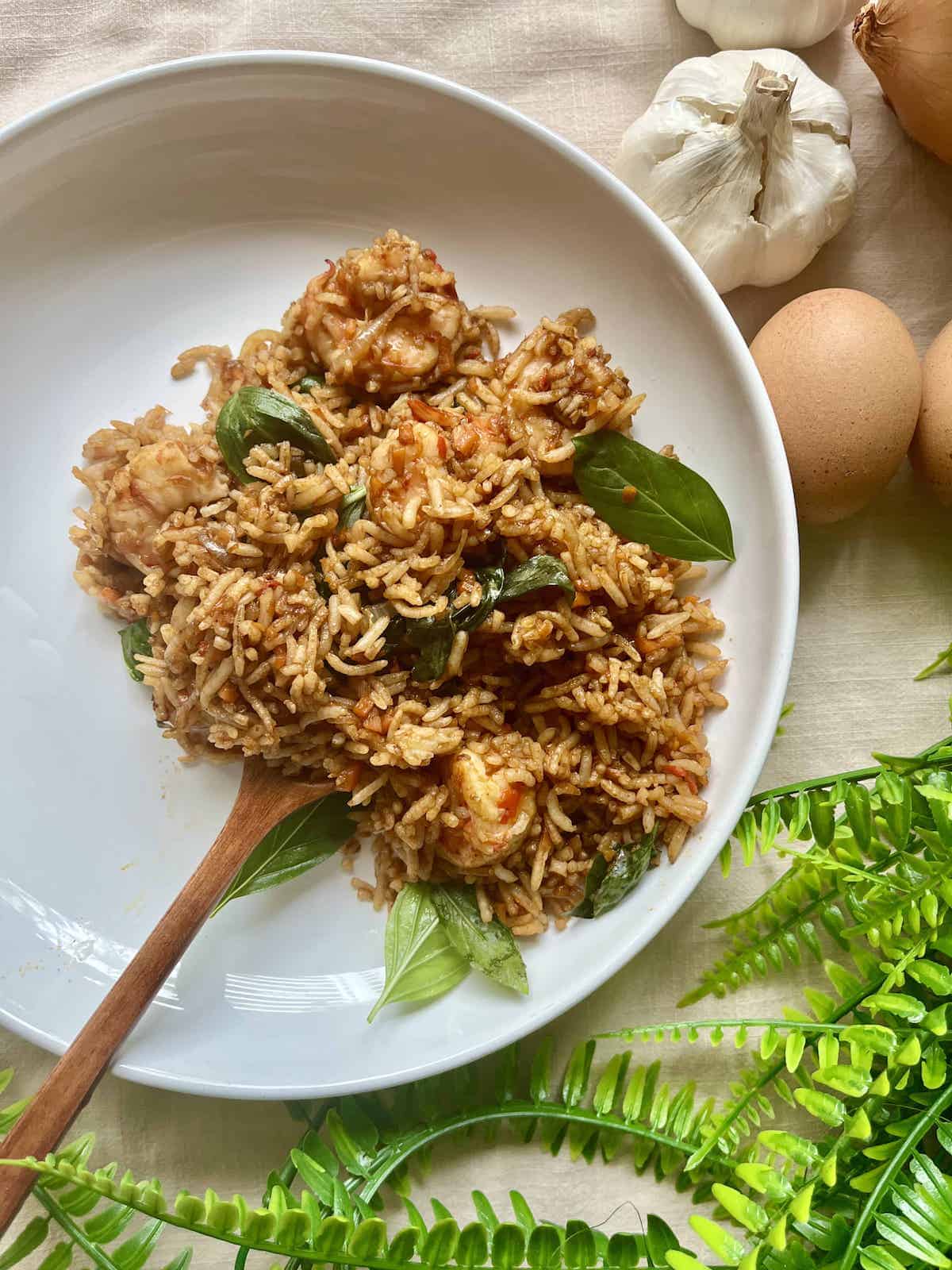 A plate of Spicy Thai Fried Rice with Thai Basil and Shrimp.