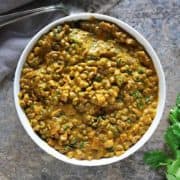 A bowl of green mung bean curry.