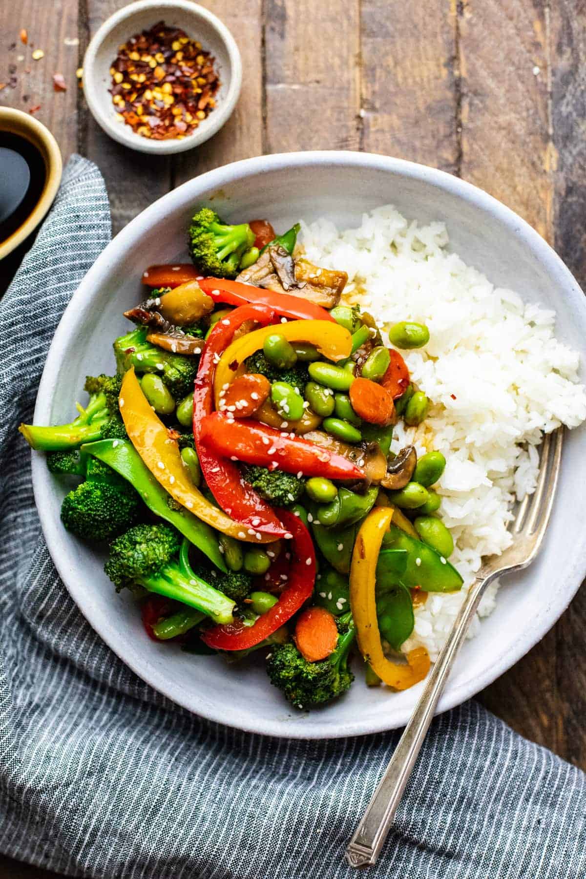 A colourful plate of veg and rice.