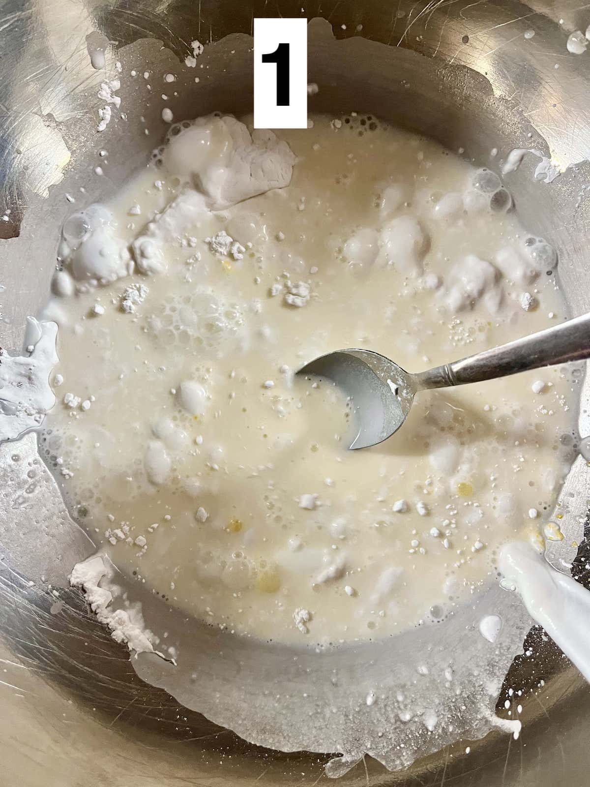 Mixing the rice batter for Vietnamese sizzling crepes.