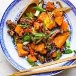 Beef and butternut squash stir-fried with cumin.