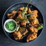 A plate of Indian Chicken Pakoras with sauce