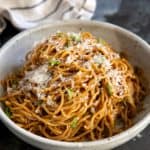 A bowl of garlic soy noodles with cheese